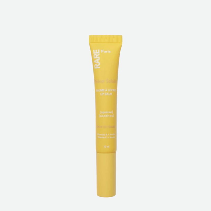 Rare Paris Trésor Solaire Soothing Lip Balm – lūpų balzamas su vitaminu E ir arnikos ekstraktu.