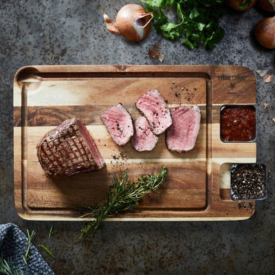 Steak Champ cutting board with sauce containers